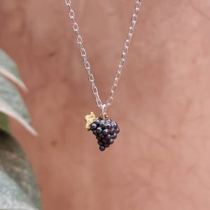 Black grapes pendant with gold vine leaf