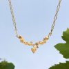 Gold twisting vine leaves and grapes necklace